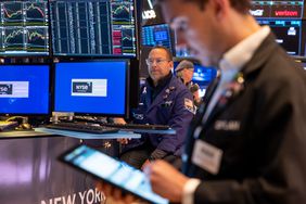 Traders work on the floor of the New York Stock Exchange (NYSE) on May 19, 2025 in New York City.