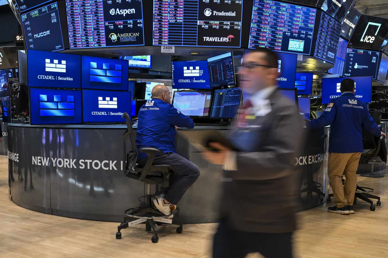 Traders work on the floor of the New York Stock Exchange