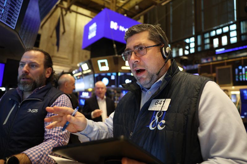 Traders work on the floor of the New York Stock Exchange