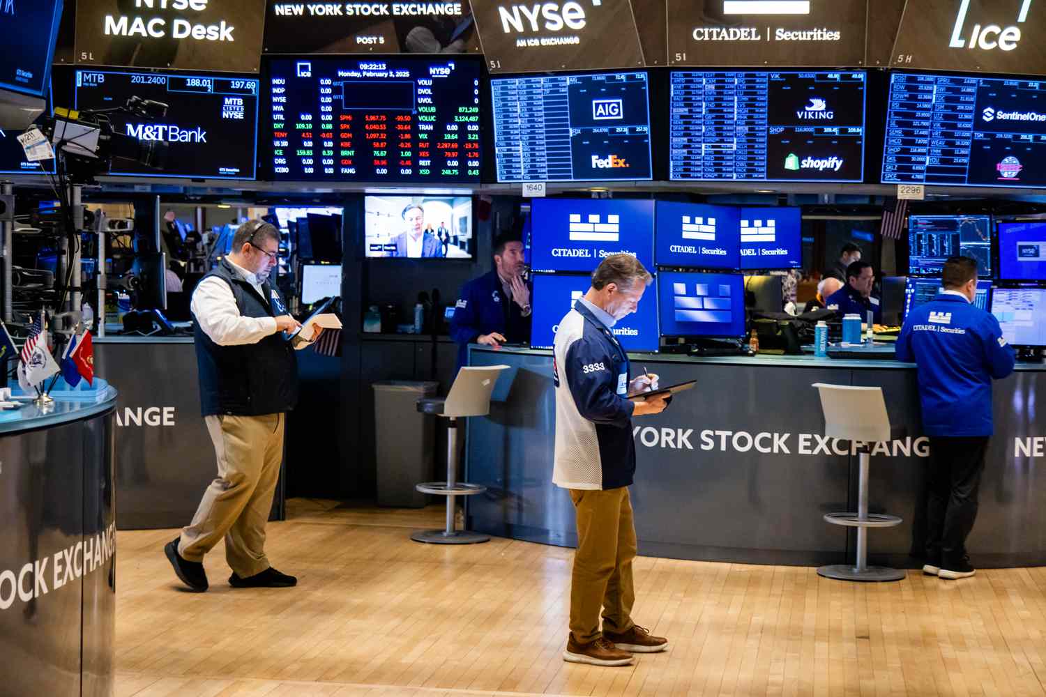 Traders work on the floor of the New York Stock Exchange