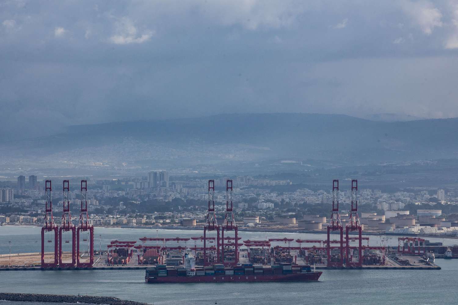 Cargo ships at Israel's Haifa commercial shipping port. Yemeni Houthis have threatened cargo vessels sailing through the Red Sea if they are heading for Israeli ports.