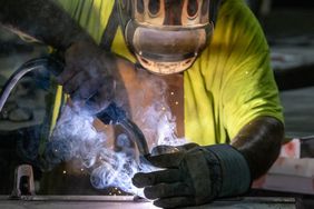 A worker welds a door at a facility in Sacramento, Calif., on May 27. 