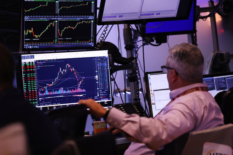 A trader looking at a chart on a computer screen