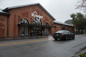 A car passes a Kroger store.