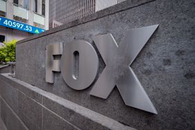 The Fox logo is seen on a sign next to buildings in New York City.