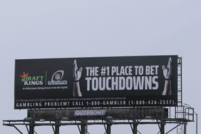 A DraftKings Sportsbook, the official sports betting partner of the NFL Playoffs, advertisement on a OUTFRONT billboard on January 25, 2025 in Kansas City, Kansas.