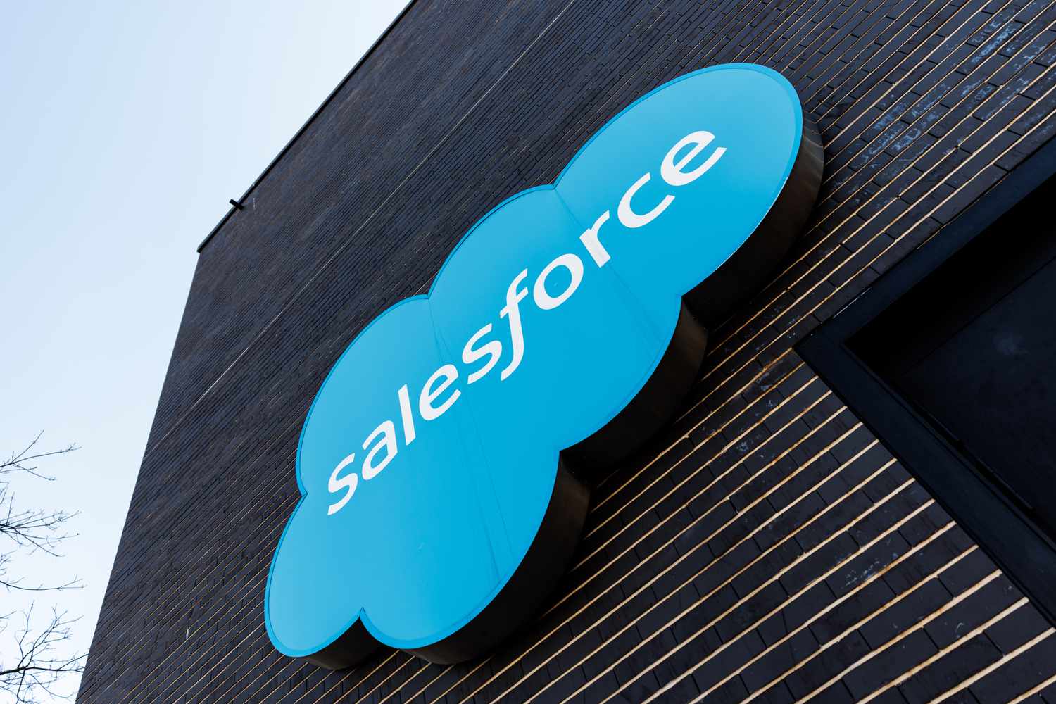The blue Salesforce logo is seen on the side of a building.