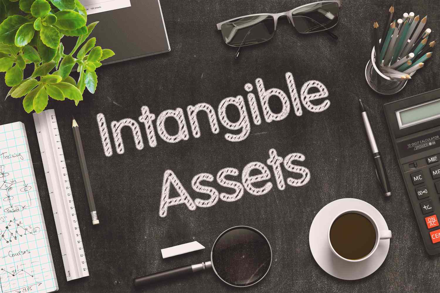 A work desk with intangible assets written in chalk