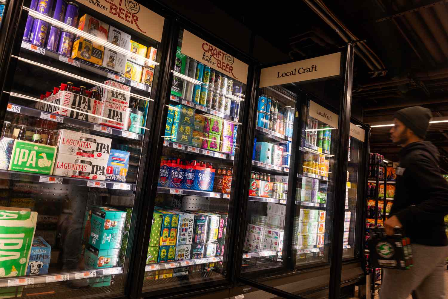 Beer cans are displayed on a grocery store shelf on February 11, 2025 in New York City.