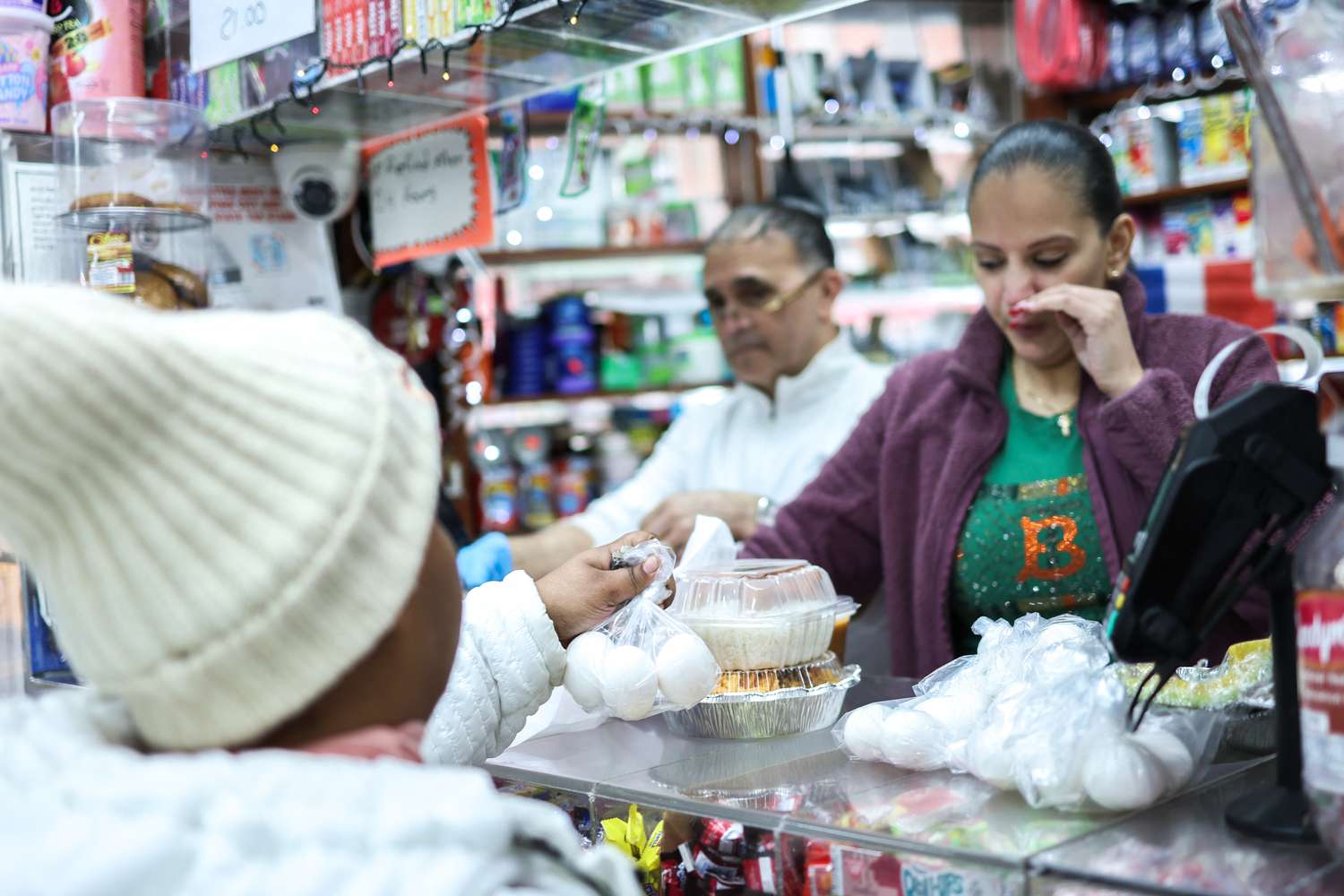 A customer buys a bag of three eggs pictured in a bodega in the Bronx borough of New York City on February 27, 2025. 