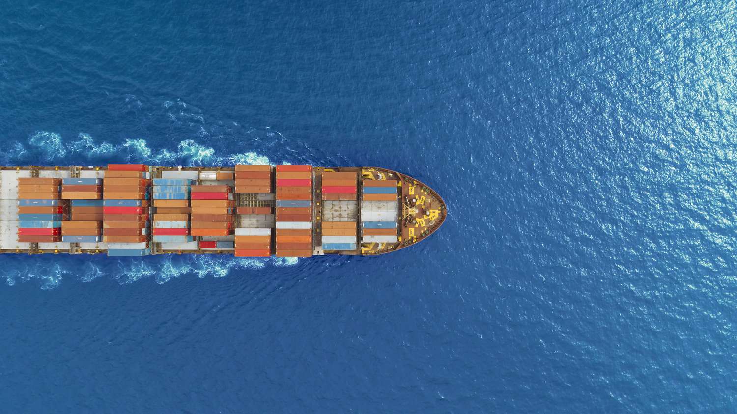 aerial top view container ship runing have wave in green sea, bangkok, thailand.