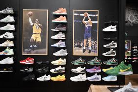 Nike shoes and pictures of LeBron James and Devin Booker are seen on the wall of a Dick's Sporting Goods store in Chicago.