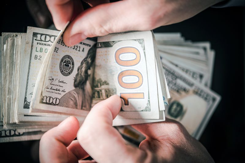 Cropped Hands Counting Paper Currencies