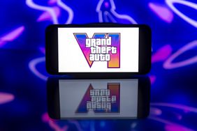 Grand Theft Auto logo is seen displayed on a mobile phone screen