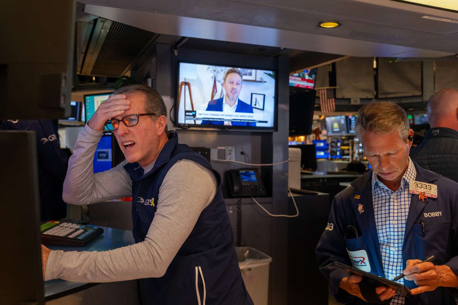 Traders work on the floor of the New York Stock Exchange.