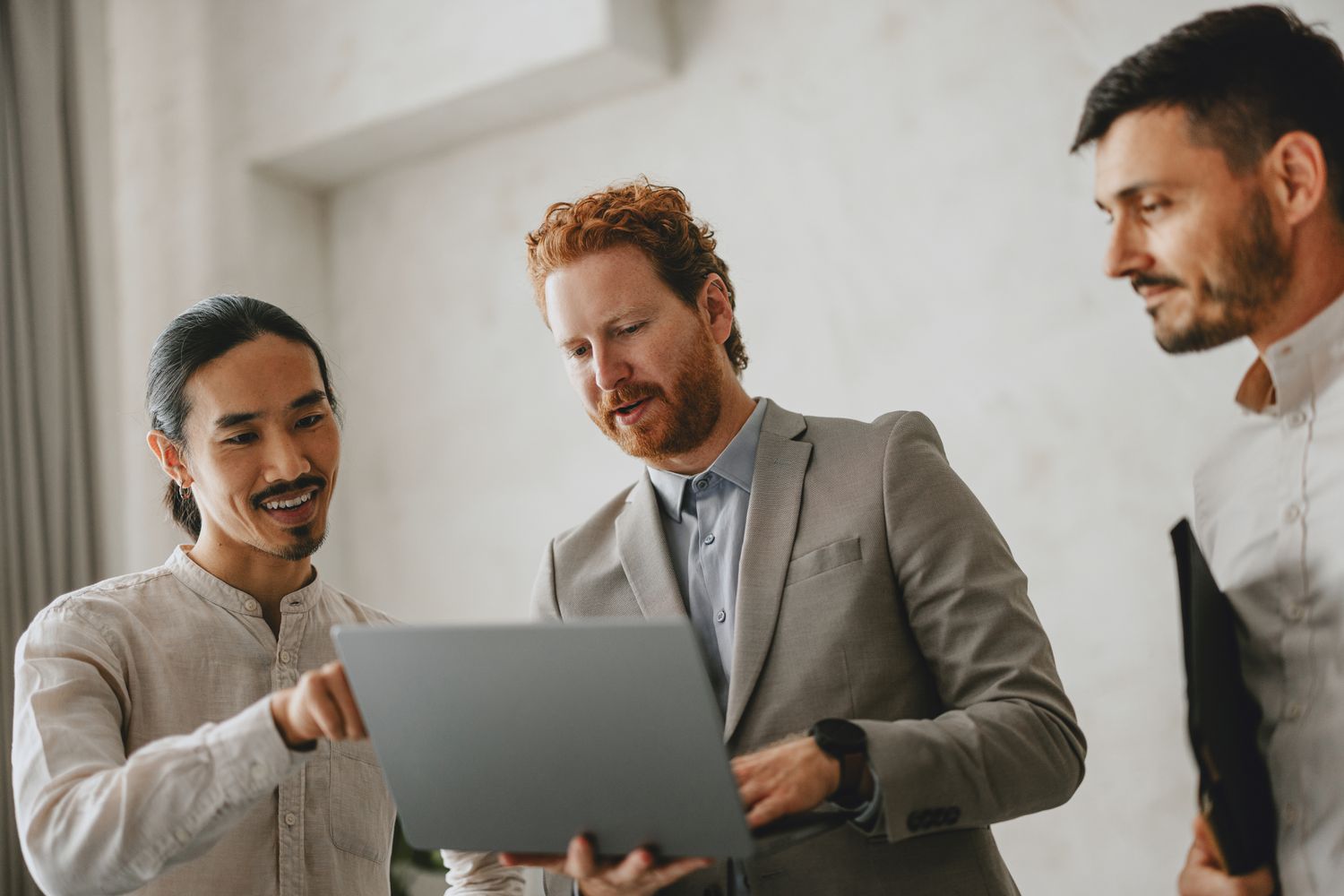 Work colleagues with a laptop computer