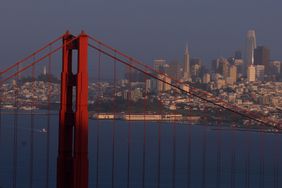The Golden Gate Bridge stands in front of the San Francisco skyline