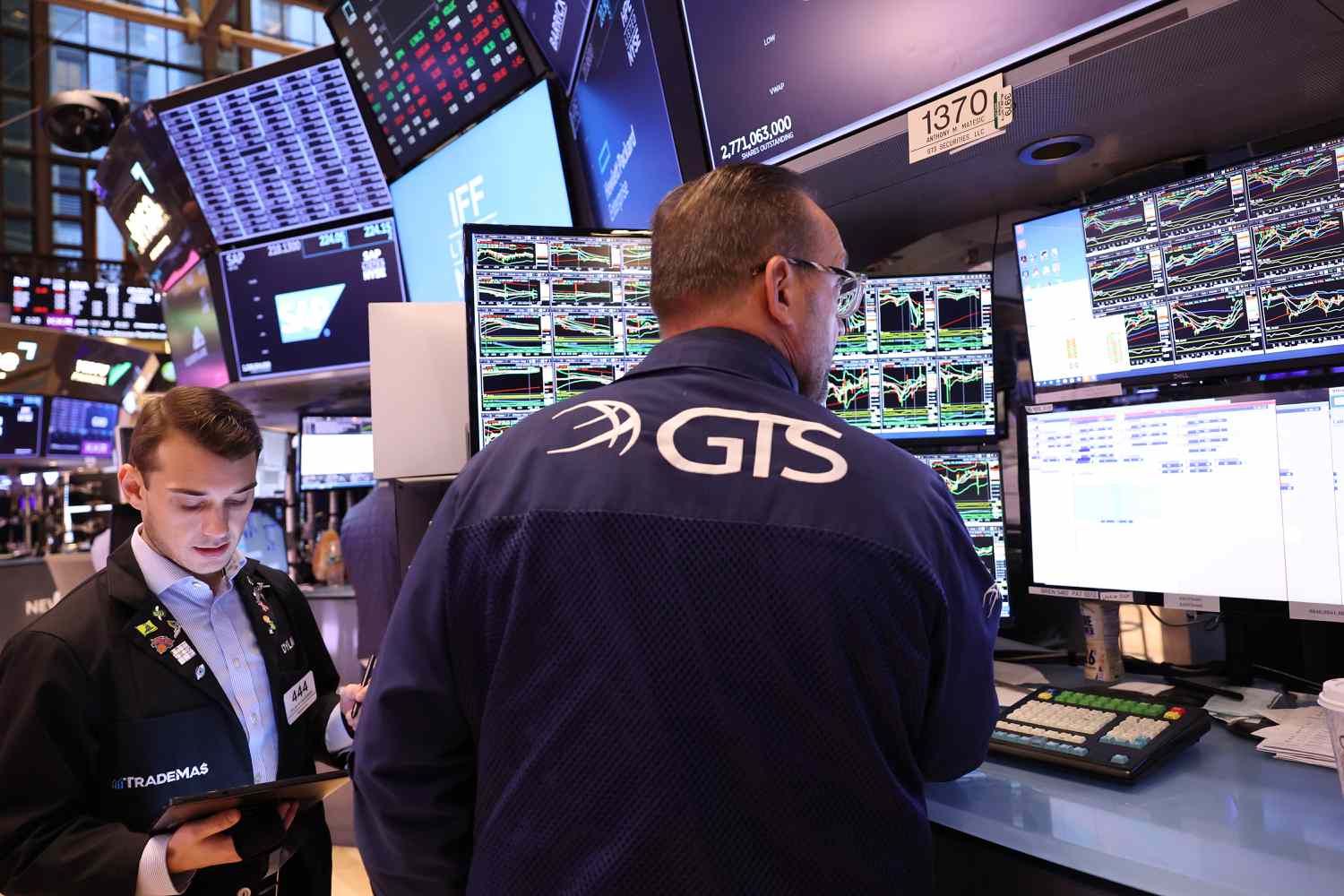 Traders work on the floor of the New York Stock Exchange
