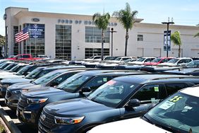 Cars parked in a Ford lot.