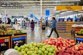 Customers shop at a Walmart. 