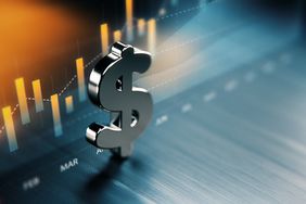 American dollar graph standing in front of a graph