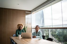 Financial advisor talking to customer at home about CD rates