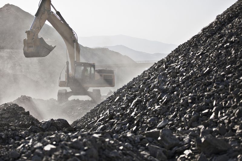 Digger Working in Quarry
