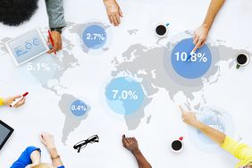 Group of business people discussing global market.