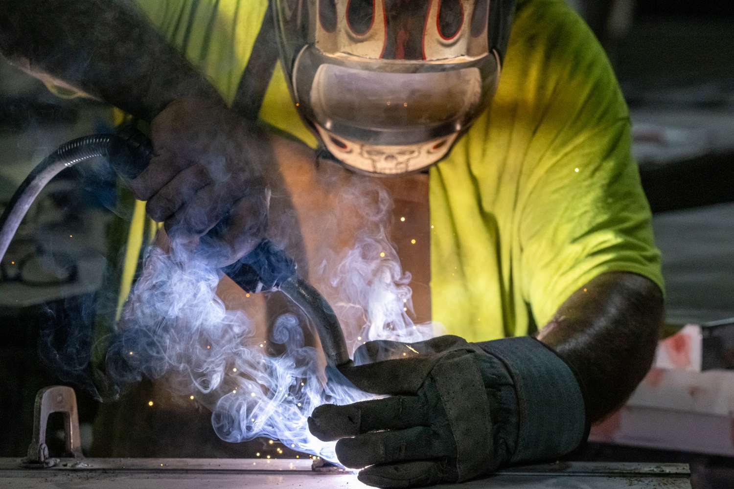 A worker welds a door at a facility in Sacramento, Calif., on May 27. 
