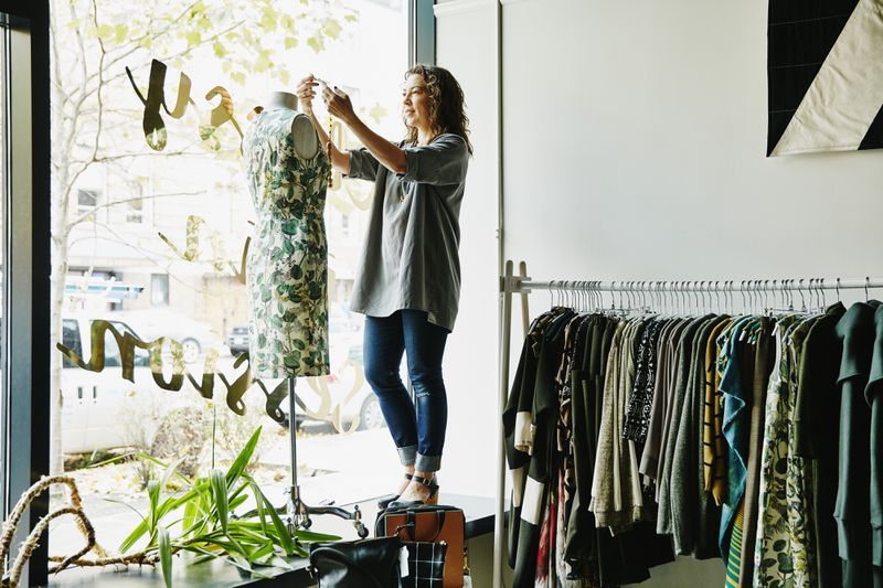 Female business owner dressing dress form