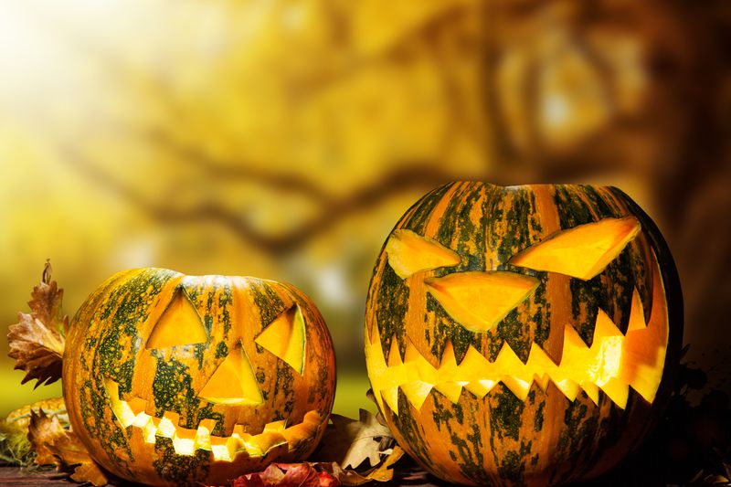 Scary halloween pumpkins on wood