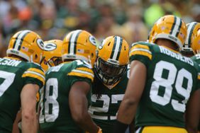 Running Back Eddie Lacy #27 of the Green Bay Packers gets a play call in the huddle against the New York Jets at Lambeau Field on September 14, 2014 in Green Bay, Wisconsin. 