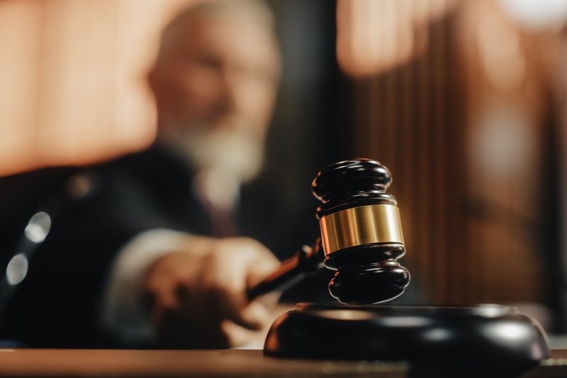 A judge bangs a gavel after making a legal ruling on a case.
