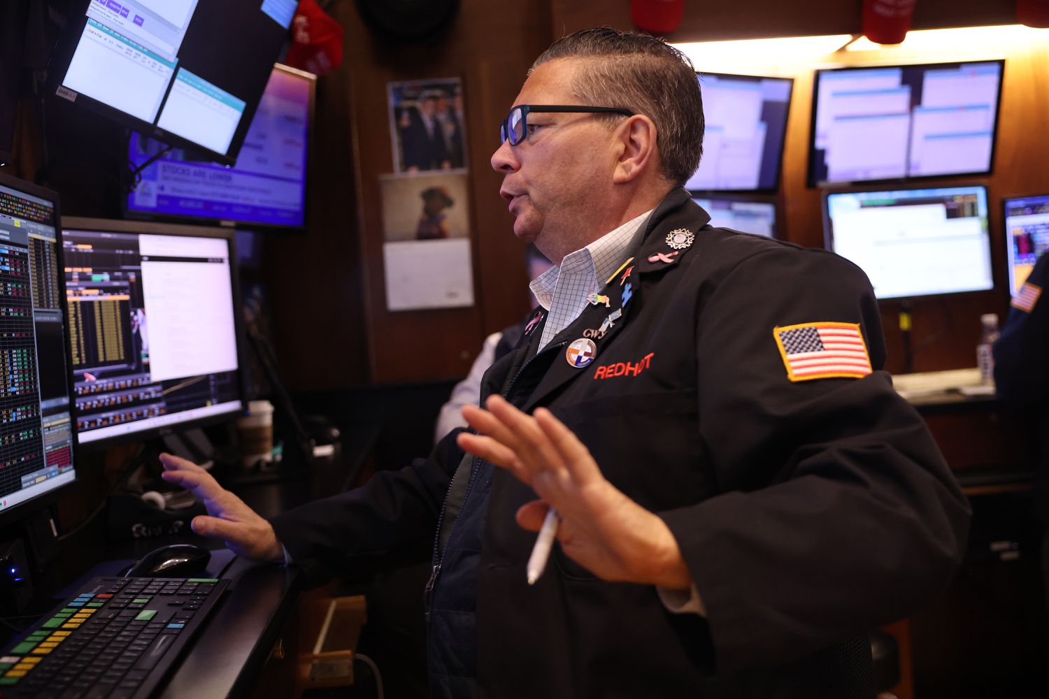 Traders work on the floor of the New York Stock Exchange during morning trading on August 20, 2024 in New York City. 
