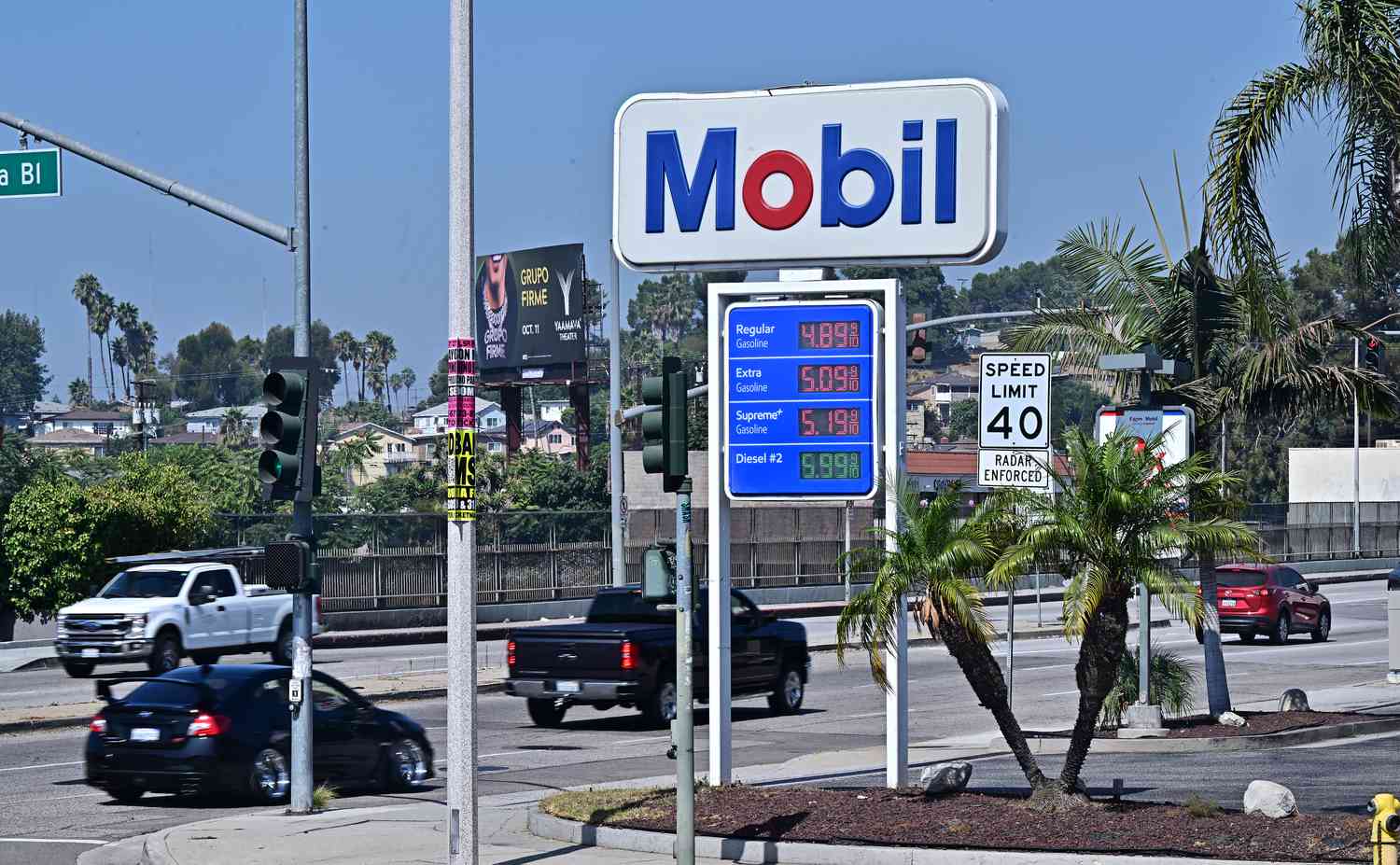 Vehicles pass an ExxonMobil gas station on September 23, 2024 in Rosemead, California