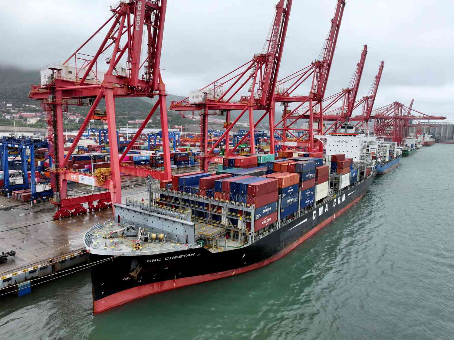 A cargo ship moors at the container terminal berth of Lianyungang Port for loading and unloading containers in Lianyungang City, Jiangsu Province, China, on May 9, 2025.