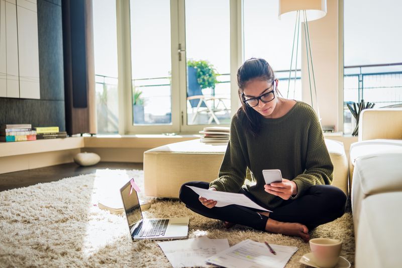 A woman pays bills.