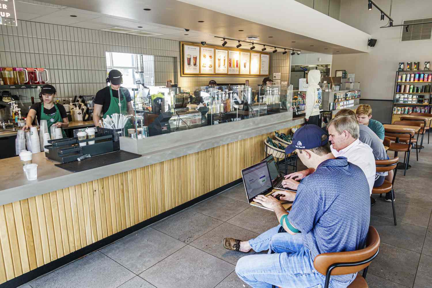 Guests use computers at a Starbucks.