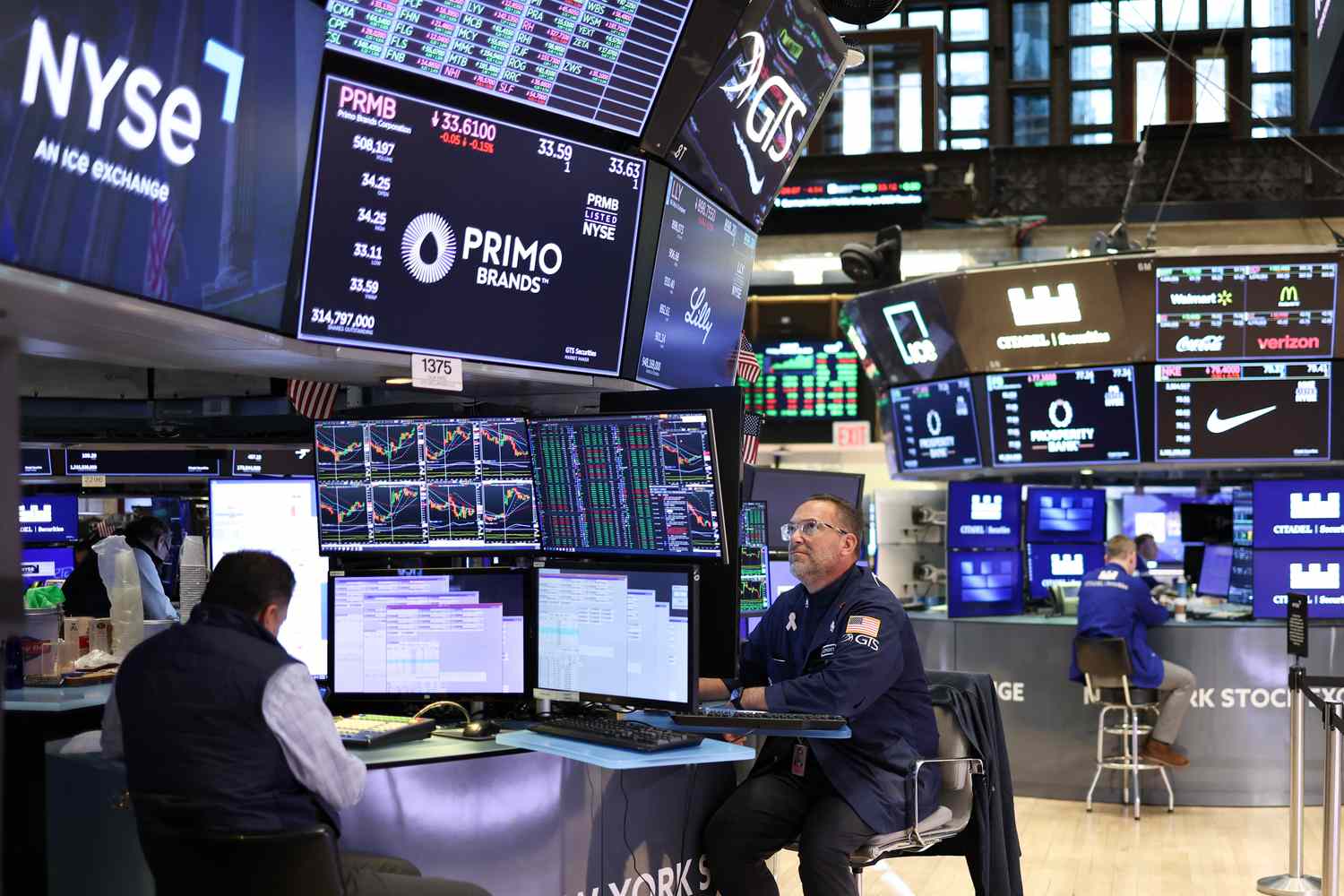 Traders work on the floor of the New York Stock Exchange