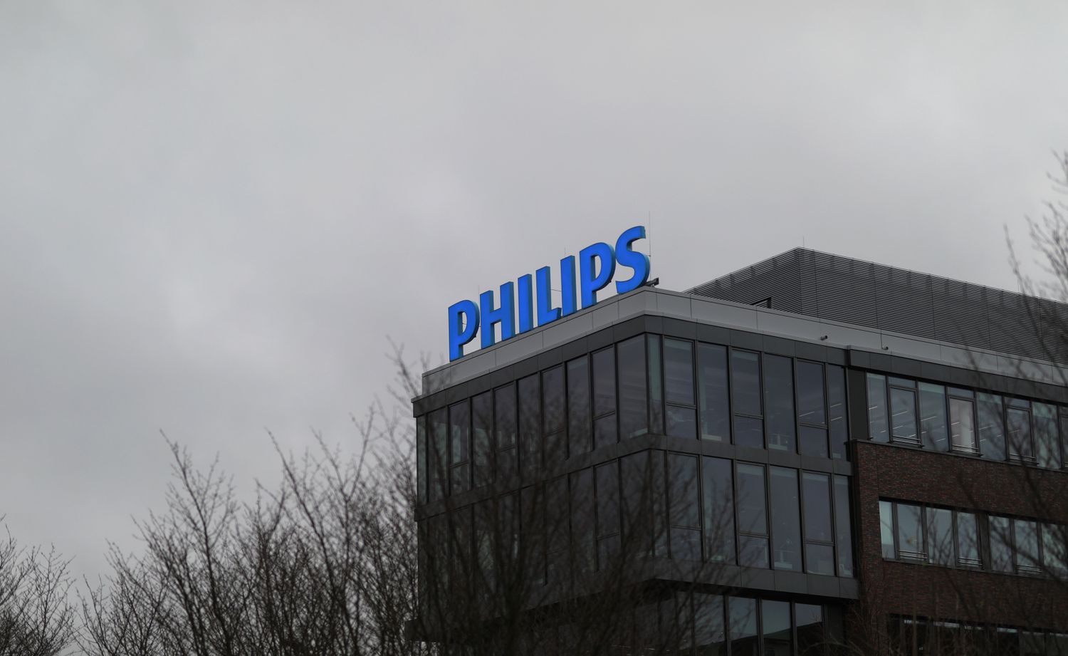A view of a Philips logo on the exterior of a building.
