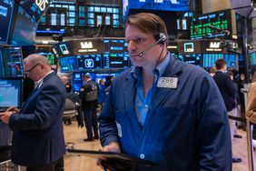 Traders work on the floor of the New York Stock Exchange 