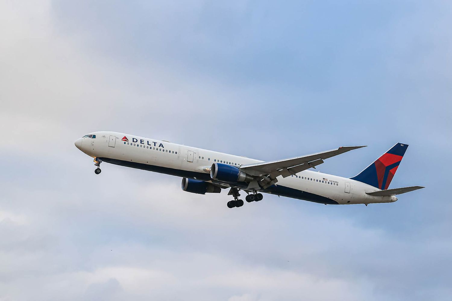 Delta Air Lines wide-body Boeing 767-400 airplane with tail number N836MH landing at London Heathrow Airport in the UK.