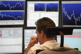  trader looks on during a trading session on the floor of Frankfurt stock exchange on September 30, 2008 in Frankfurt am Main, Germany.