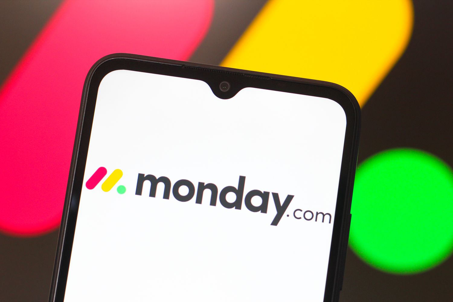Monday.com logo is seen displayed on a smartphone screen