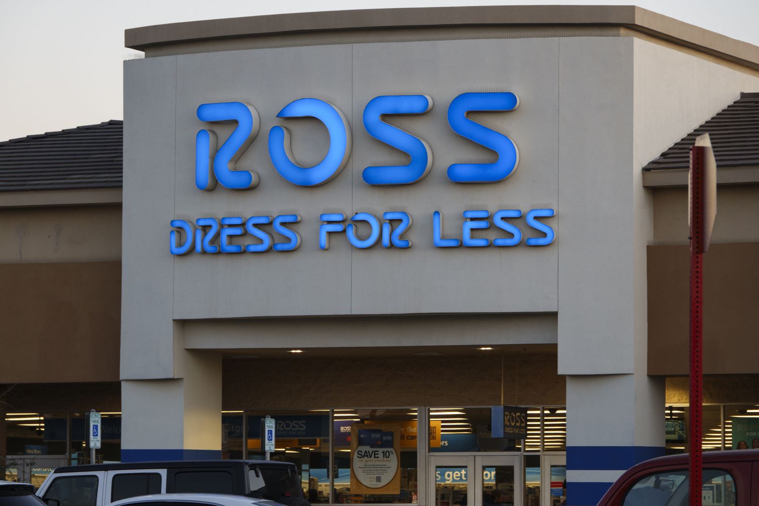 The blue Ross Dress for Less logo is seen above the entrance to a store.