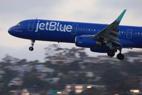A JetBlue Airways Airbus A321 airplane approaches San Diego International Airport