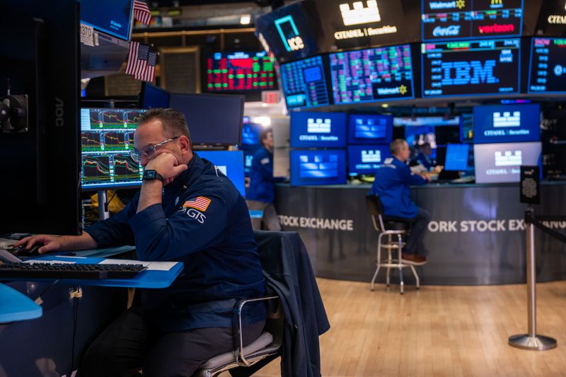 Traders work on the floor of the New York Stock Exchange