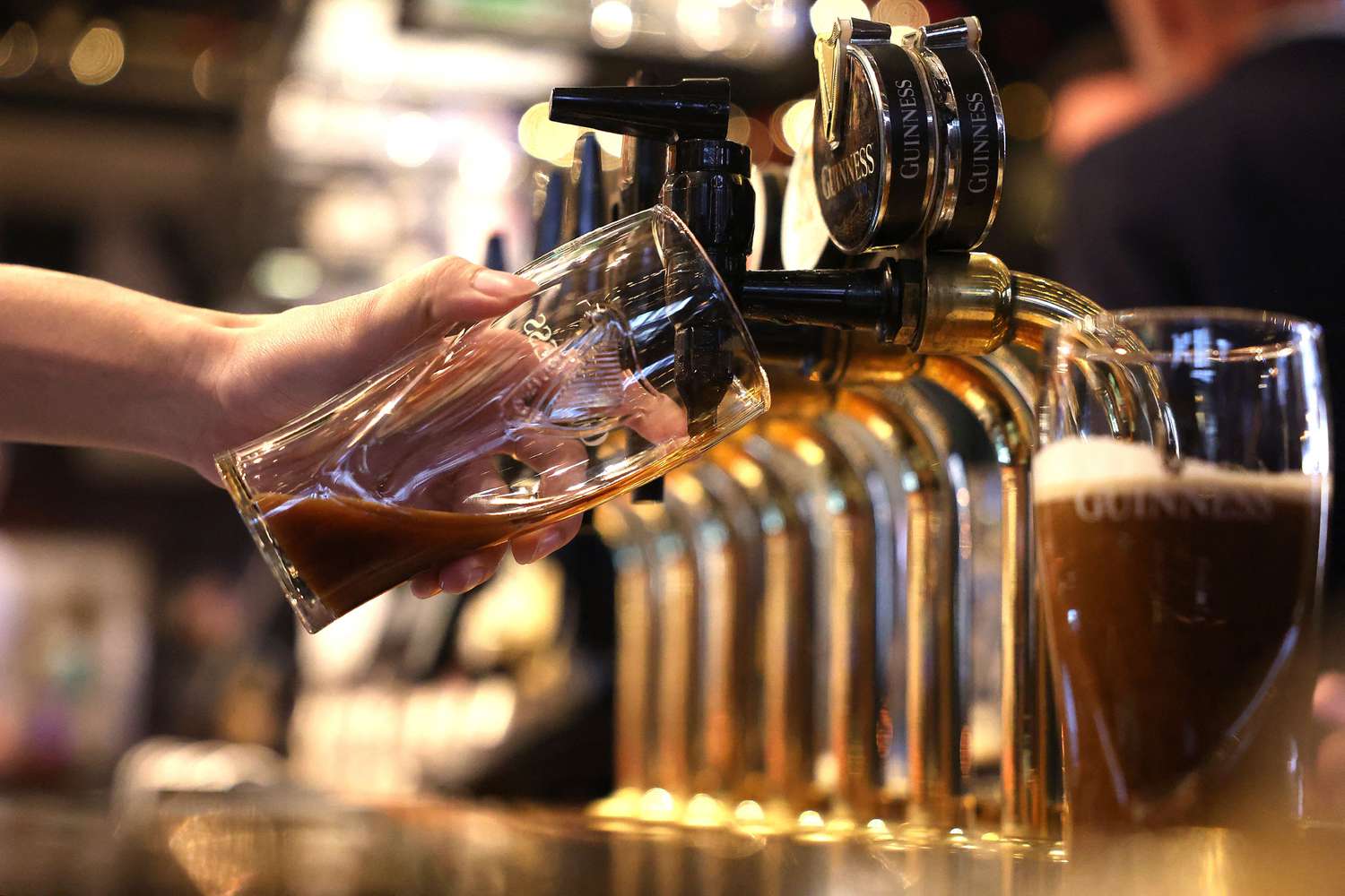 A bar worker pours a Guinness in London in November. 