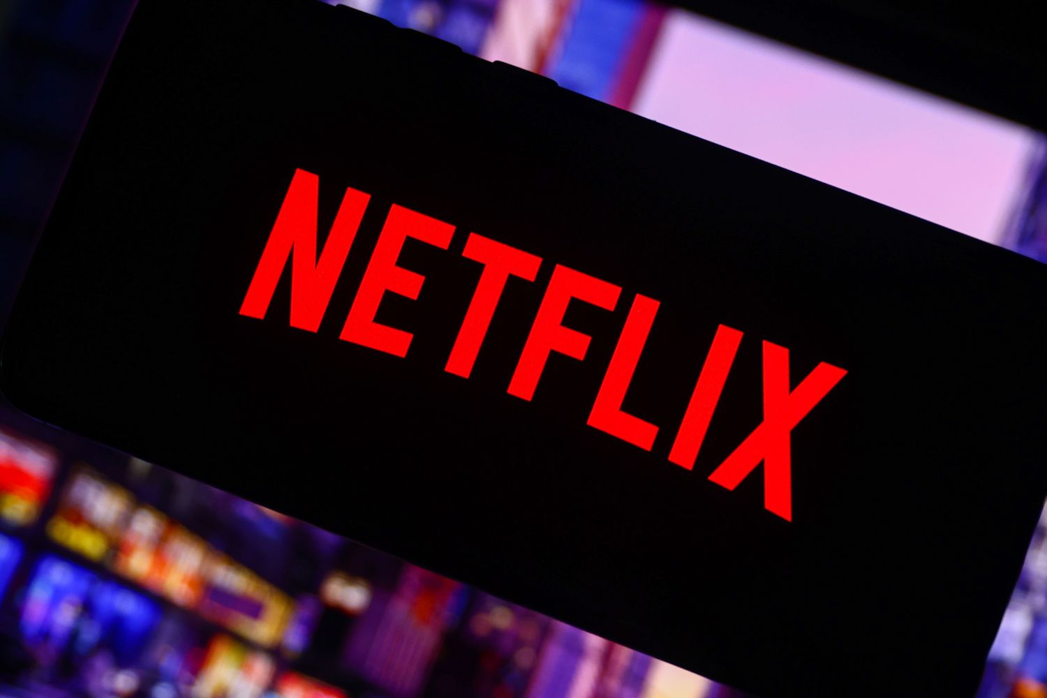 Netflix logo is screened on a mobile phone.