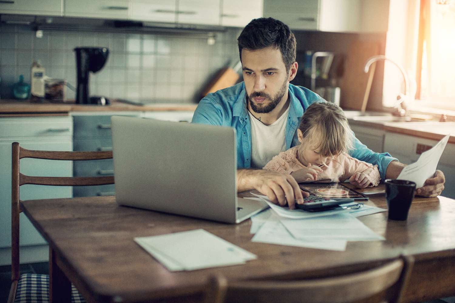 Father and daughter looking at insurance bills